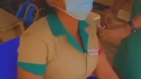 Nurse cries as she gets injected