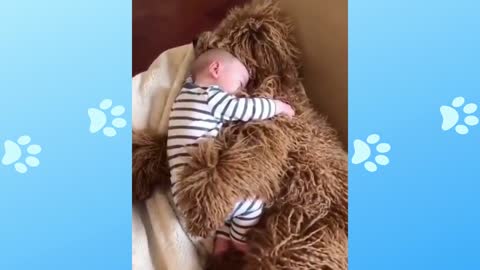 Baby sleeping hugging the dog