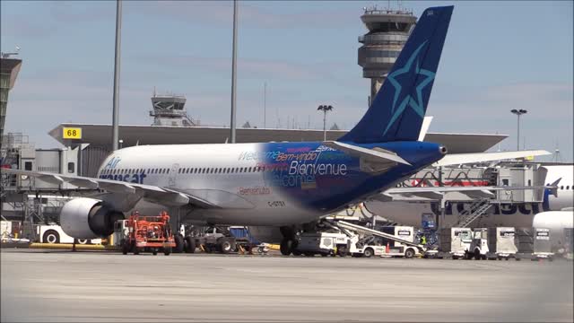 An Airplane Taxiing On The Airport Terminal