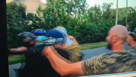 Ukranian forces grabbing some people and forcing them into a truck