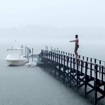 Get guys ready to jump and dive off of pier slips and flips into water fail