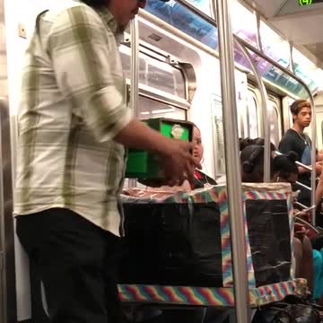 Man with a bunny rabbit on train