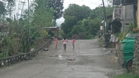 3 kids playing jumping rope ethnic game