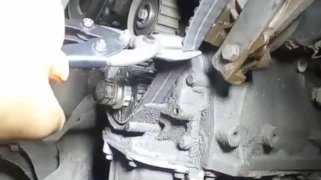 The mechanic cut off the belt.