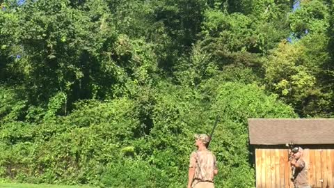 Guy in camo shooting beer can and fails