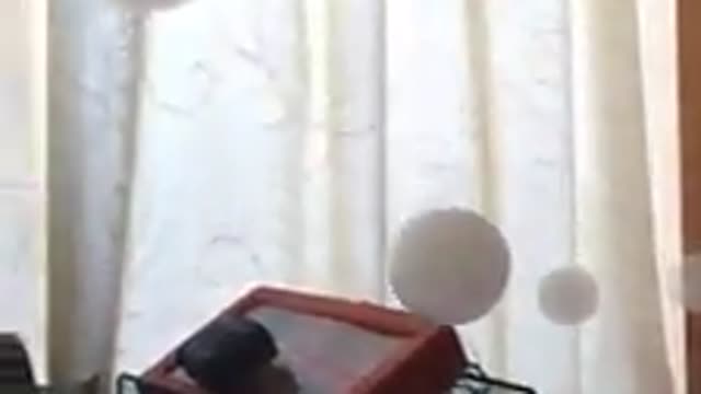 man blowing smoke into liquid soap