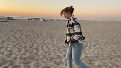 Girl on beach with Amazing sunset