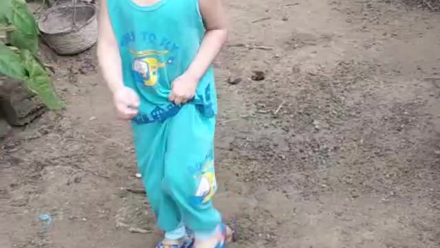 Baby trying to Catch Chicken