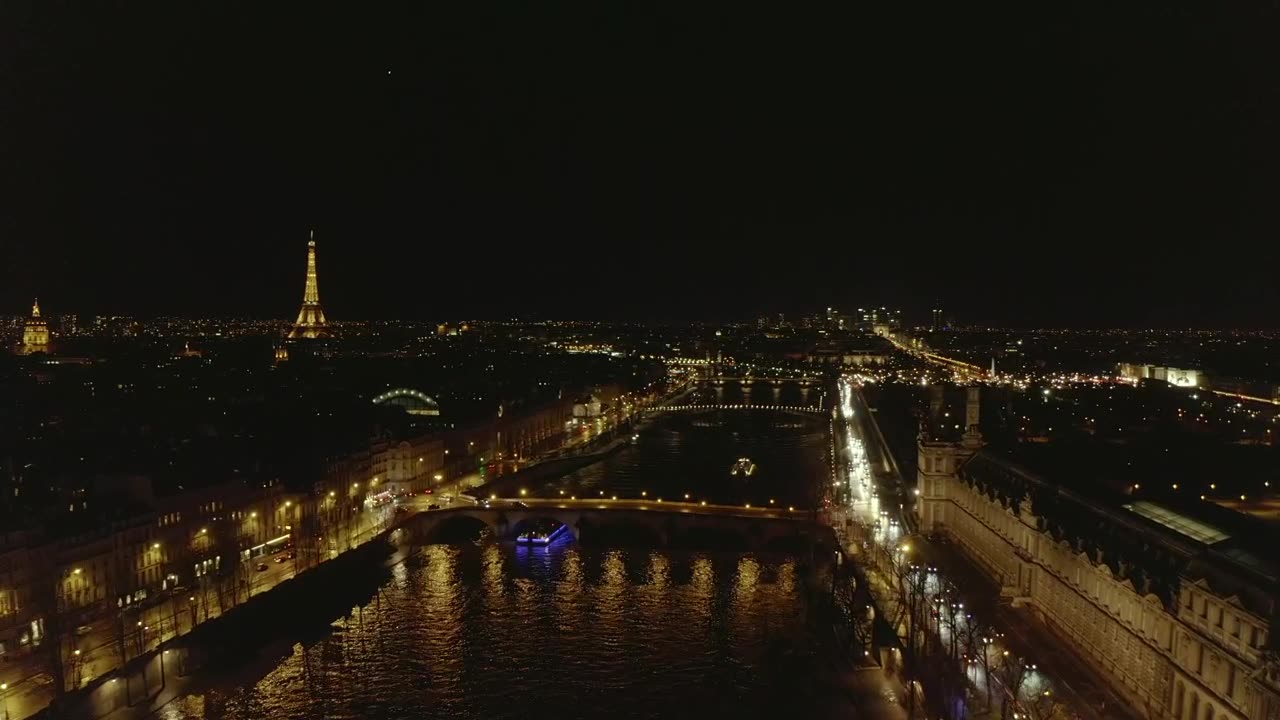 Night flight over the Seine river in Paris