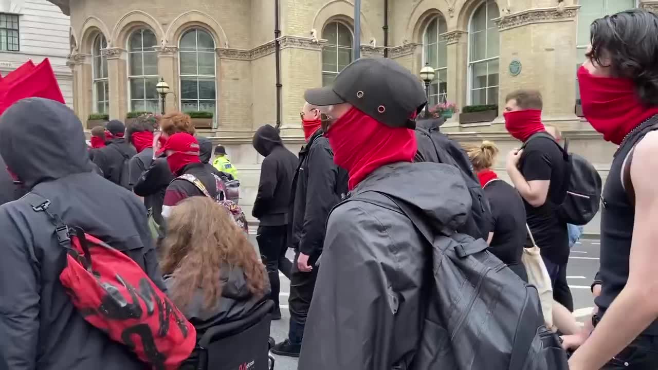 Left-wing protestors in London chant the names of communist dictators