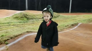 Little boy runs on bumpy road and falls down