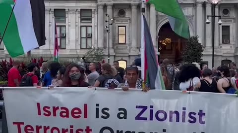 Pro-Palestinian protesters rally outside debate venue
