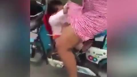 a Baby Took a Ride With Her Mom - Very Windy