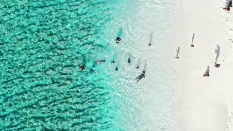 Beach front with children playing