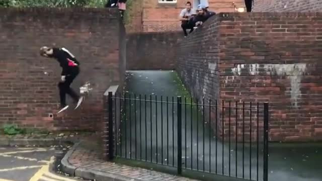 A fierce young man jumps over the fence