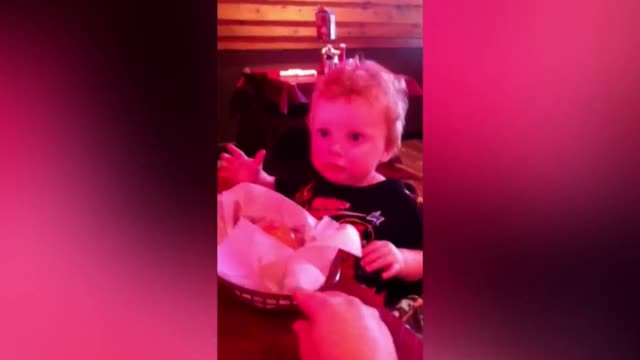 A Boy Makes Strange Face When He Sees Dinner Rolls