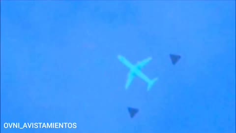 plane being escorted by UFOs