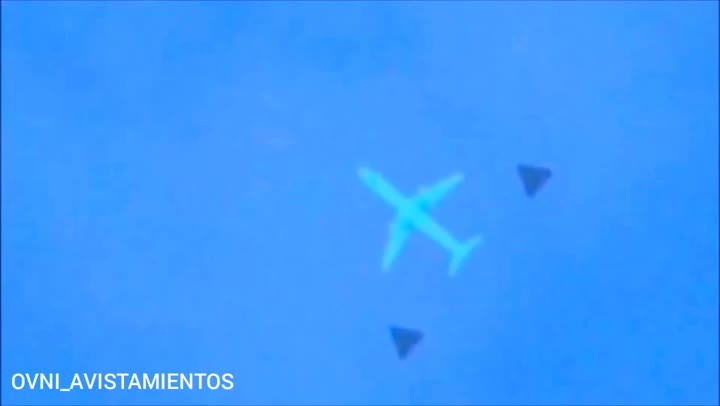 plane being escorted by UFOs