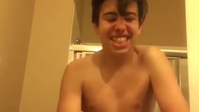 Shirtless kid super saiyan screaming bathroom