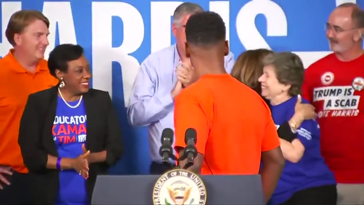 Kamala Harris enters her event in Michigan and immediately gives a big hug to teachers' union bosses