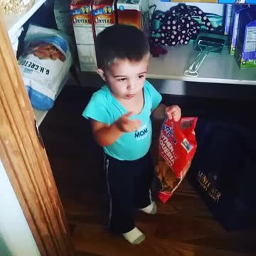 Sneaky Little Boy Eats Chips In The Pantry
