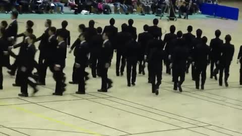 Japanese students performing synchronized crosses!💯😳🔝