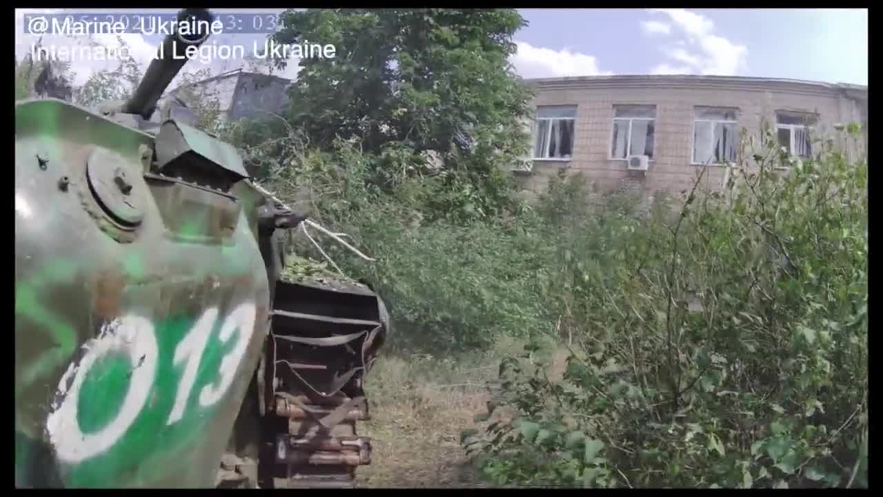 Ukrainian Foreign Legion militants move around Severodonetsk before retreating from the city.