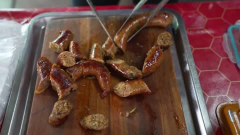 Thai sausages don't look so delicious, but this man