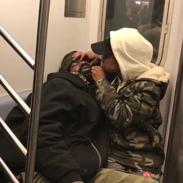 Woman pops her boyfriend's zit on subway train