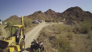 Moving Rock down a hill with a Backhoe