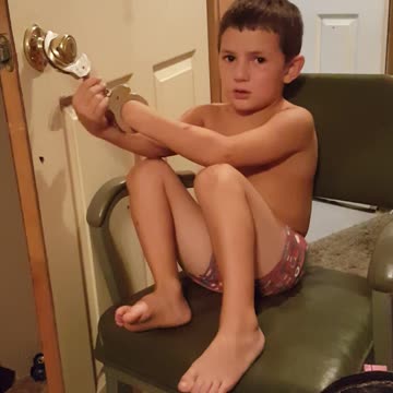 Boy Handcuffs Himself To Door Before Trying On Brothers