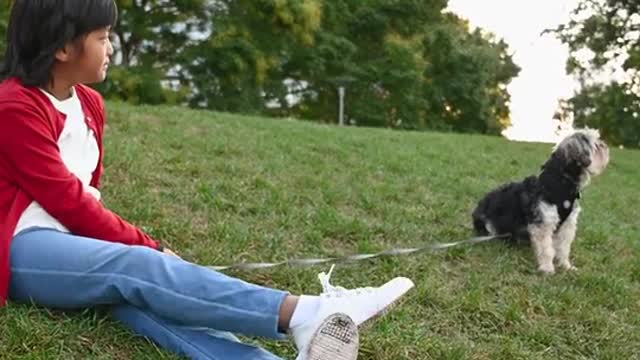 Kid Sitting on a Grass