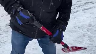 Premier Doug Ford helps dig out a motorist stranded by the snowstorm