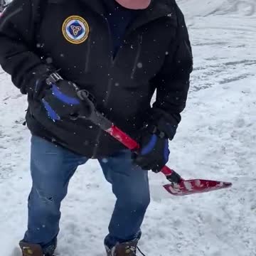 Premier Doug Ford helps dig out a motorist stranded by the snowstorm