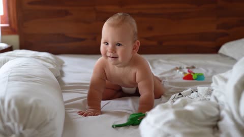 A Happy And Funny Baby On Bed d