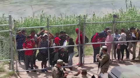 national gaurd in TX close and lock entry, border patrol open and process.