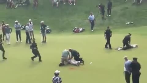 Fury as eco zealots storm golf course moments before crucial Scottie Scheffler putt at Travelers