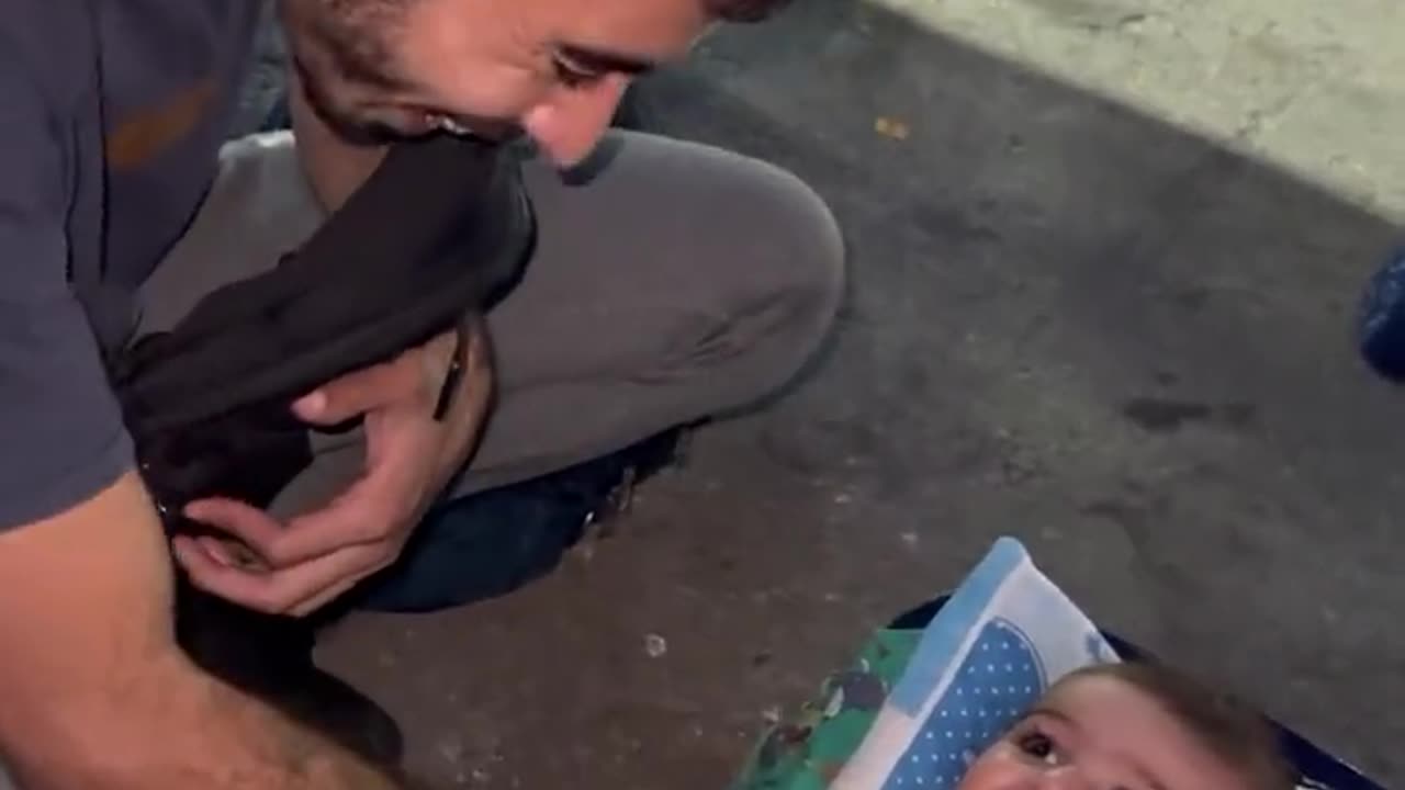 Journalist play with rescue kid in Palestine Israel war