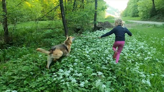 woman playing with her dog