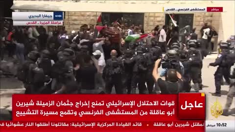 Israeli security forces charge the funeral of journalist Shireen Abu Aqla