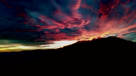 Silhouette Of Mountain Under Red Sky