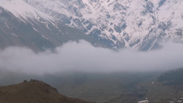 slow-motion-shot-of-snow-capped-mountain