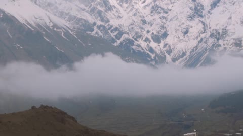 slow-motion-shot-of-snow-capped-mountain