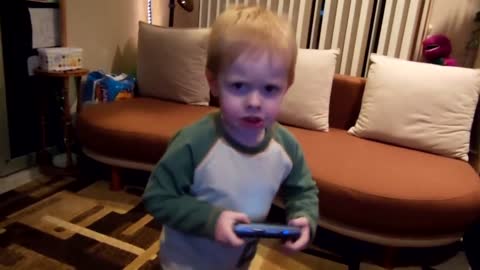 Toddler makes angry face when he dances