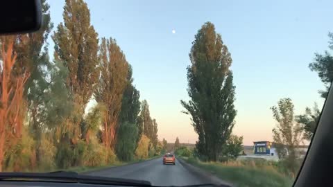 car ride sunset and moon