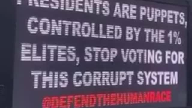 Arrest Bill Gates for crimes against humanity van cruising in the city to warn people