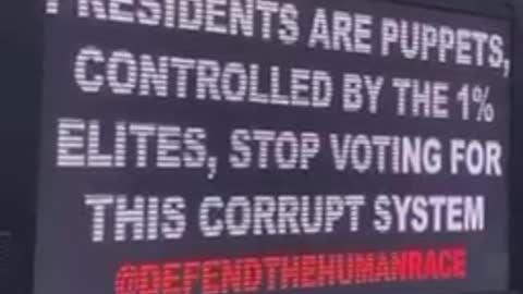 Arrest Bill Gates for crimes against humanity van cruising in the city to warn people