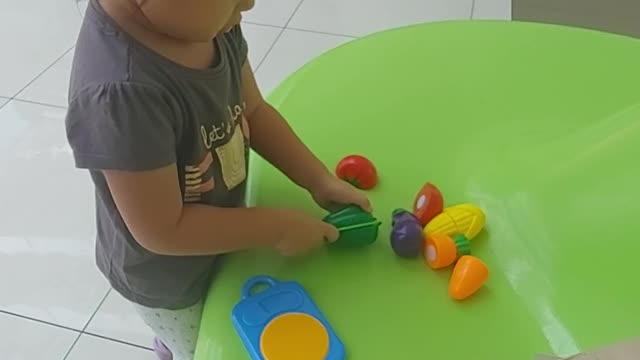 She knows her vegetable toys