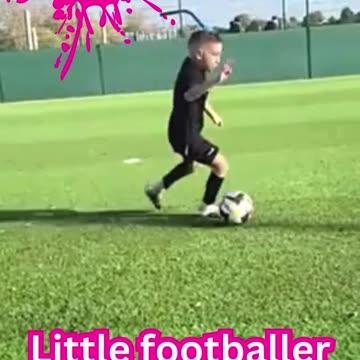 Little footballer practicing football
