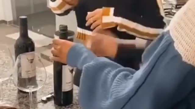 Look how she was trying to open the champagne